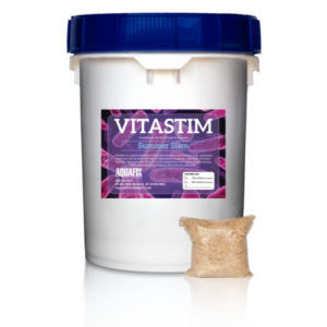 A bucket and packet of VitaStim Summer Slam, a powdered bacteria supplement for wastewater lagoons to promote overall performance and lagoon health.